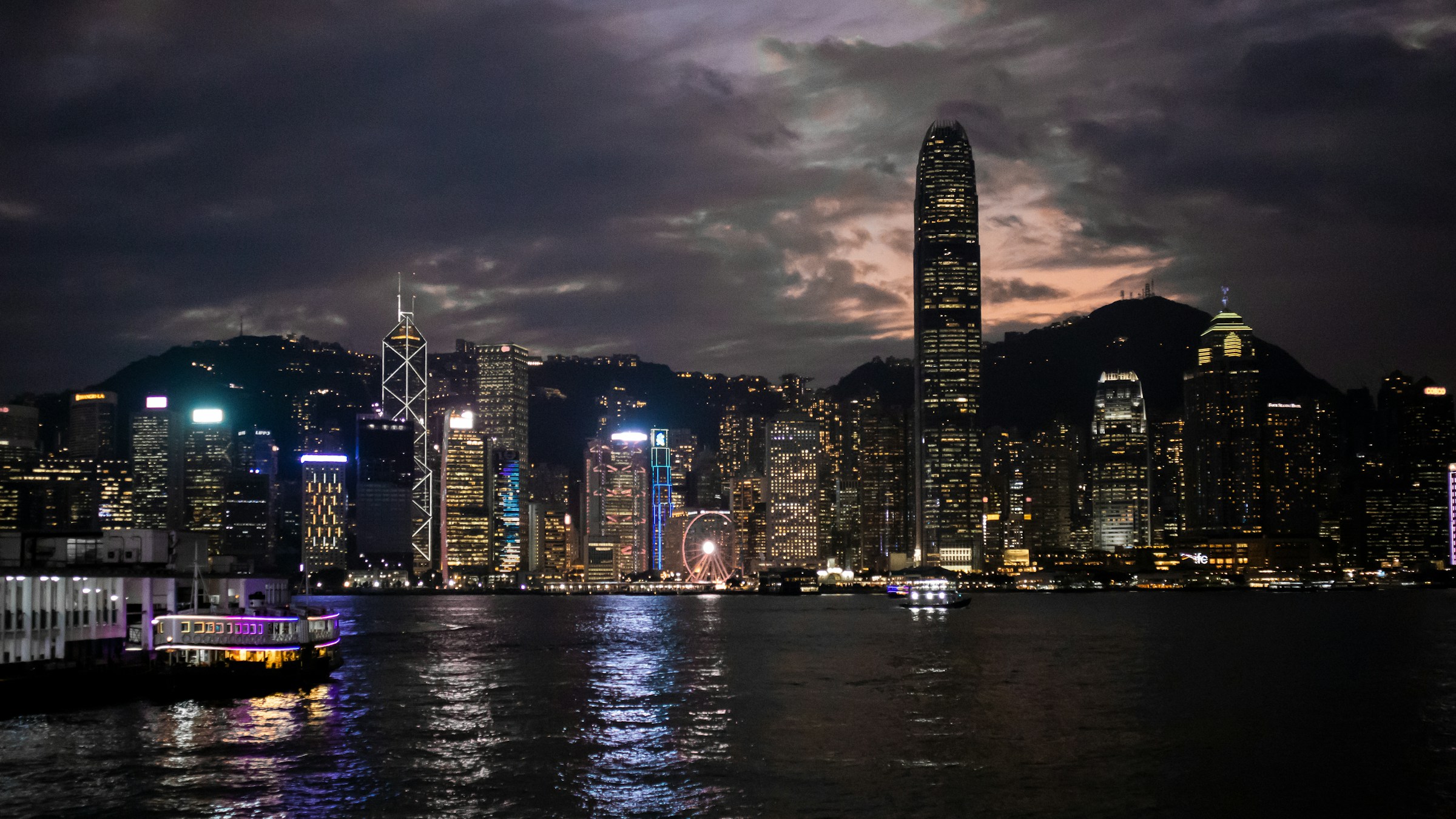 Hong Kong's Victoria Harbour skyline and mountains at dusk